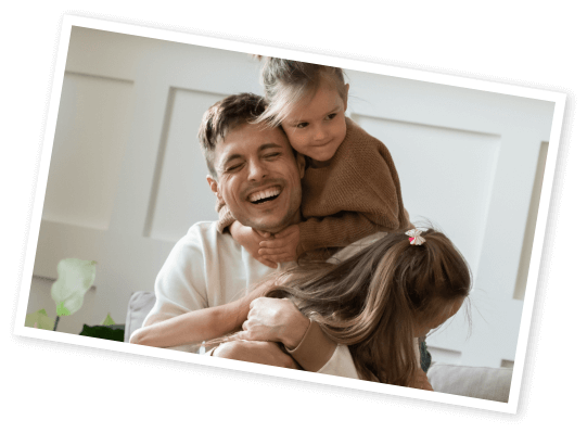 brevard_family_allies_contact Photo of man holding hugging 2 children